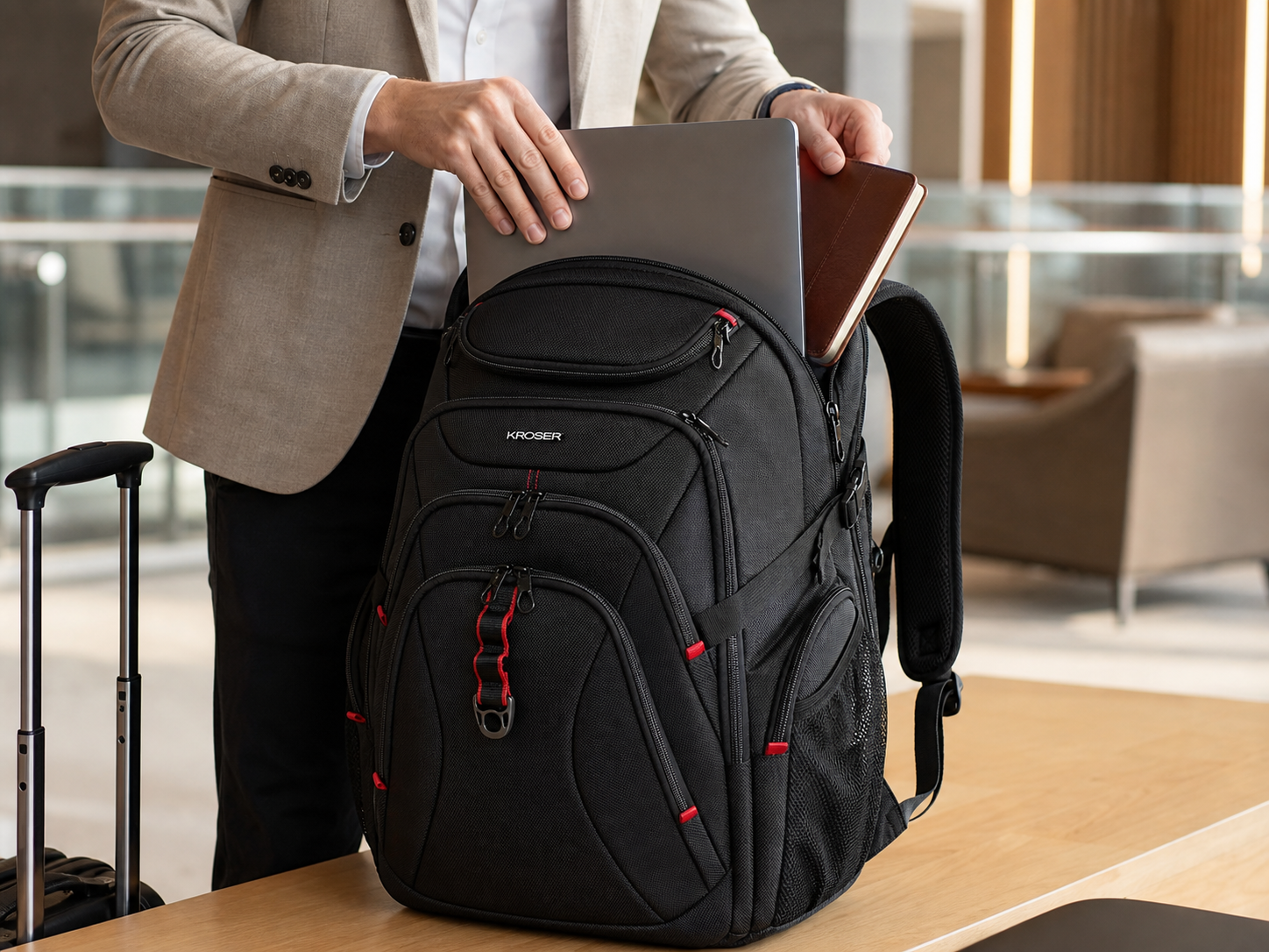 Black KROSER backpack with multiple front pockets and zipper details