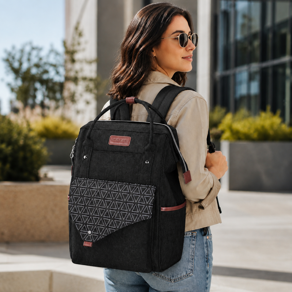 Black 15.6-inch laptop backpack with front zip pocket, patterned panel, top handle