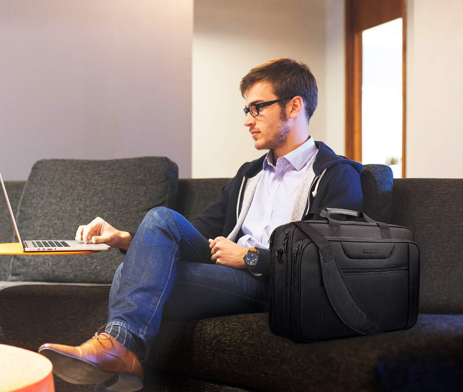Black KROSER laptop briefcase carried on shoulder with front zip pocket