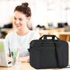 Black quilted 17-inch laptop briefcase with top handle and side strap on desk