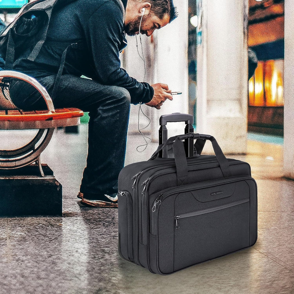 Black rolling laptop briefcase resting with telescoping handle extended