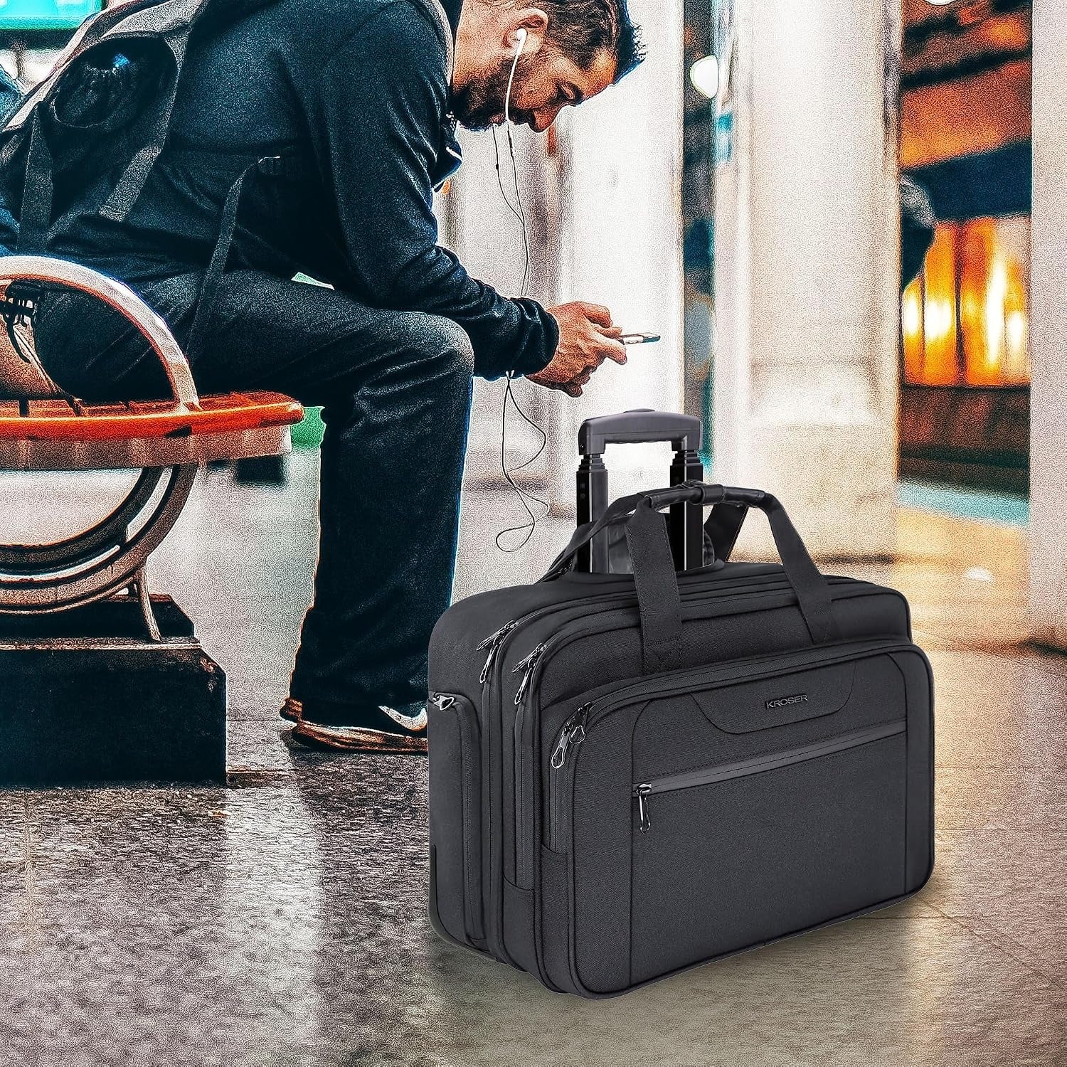 Black rolling laptop briefcase resting with telescoping handle extended