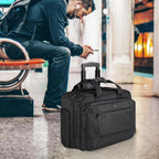 Black rolling laptop bag on wheels with front zipper pockets and top carry handle