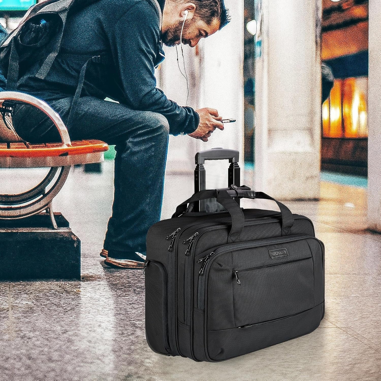 Black rolling laptop bag on wheels with front zipper pockets and top carry handle