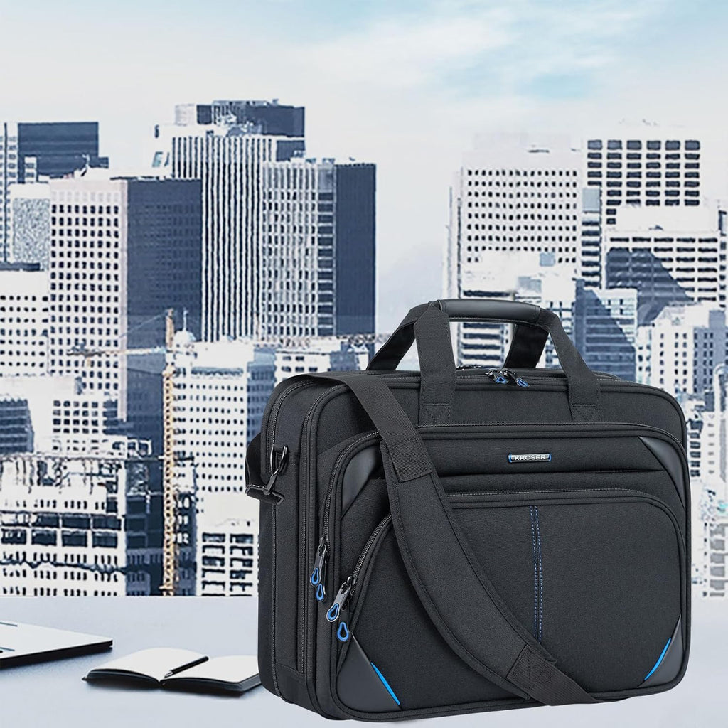 Black laptop messenger bag with front zip pockets and blue trim accents, shoulder strap attached