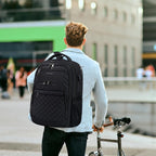 Black quilted laptop backpack carried on the back with shoulder straps