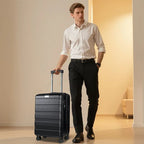 Black top-loading carry-on suitcase on wheels, pulled by an upright handle